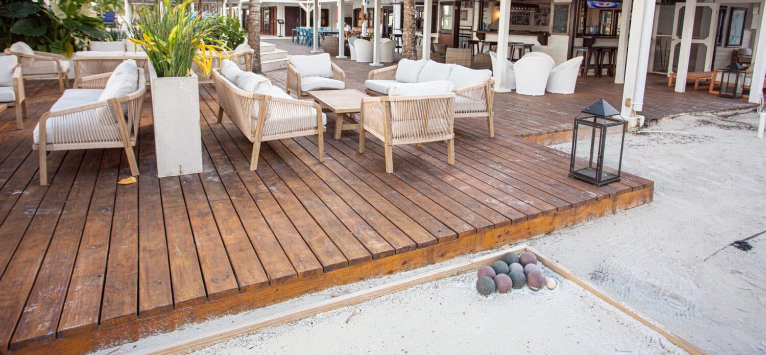 Stylish outdoor seating area alongside a bocce court for relaxed gatherings.
