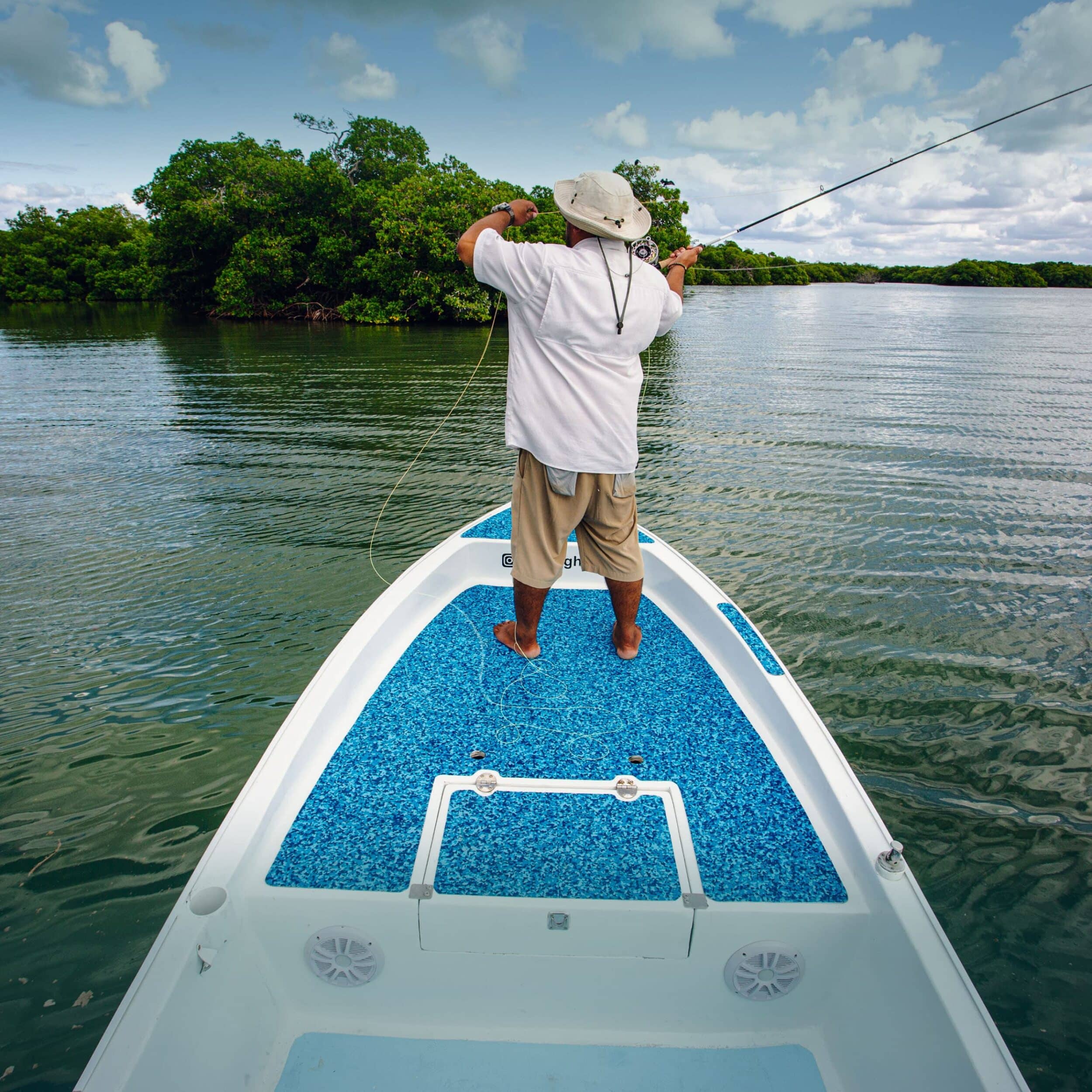 Angler casting a line on calm waters, enjoying a serene fishing adventure.