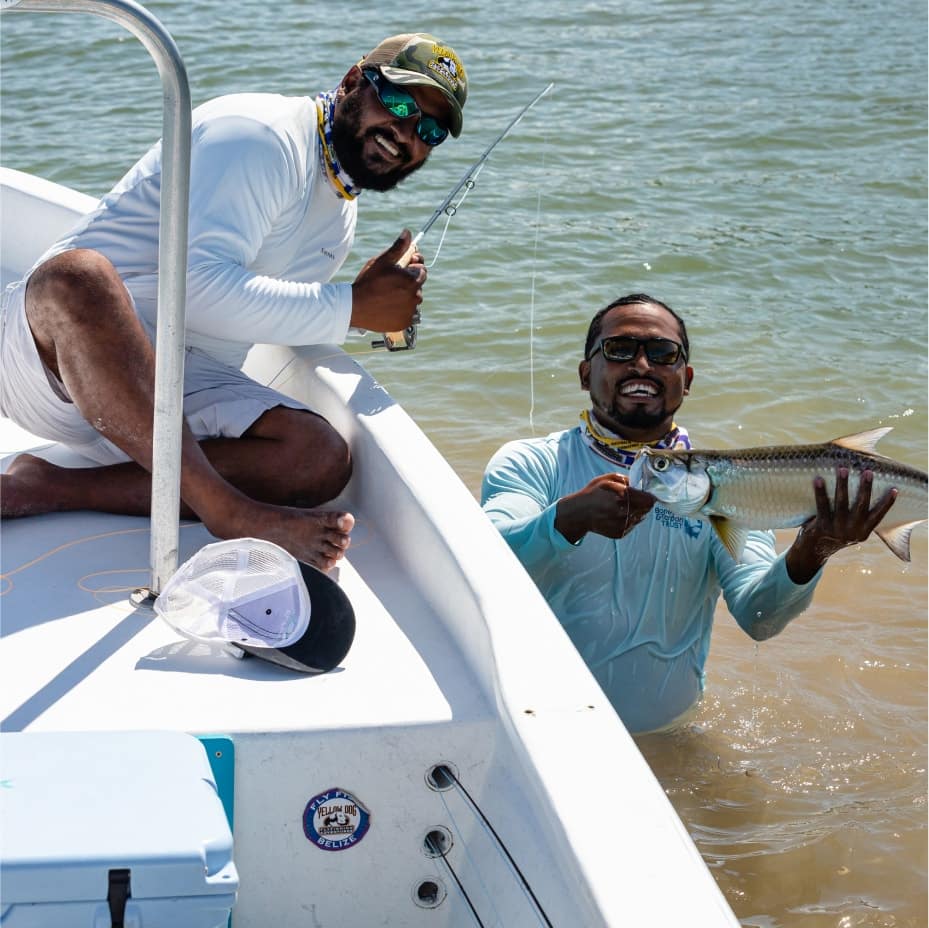 Joyful anglers celebrate their catch during a memorable day of fishing.