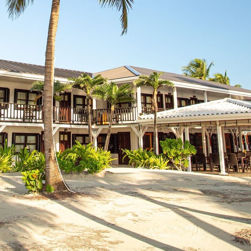 Revitalized southern facade of the main lodge surrounded by tropical greenery.