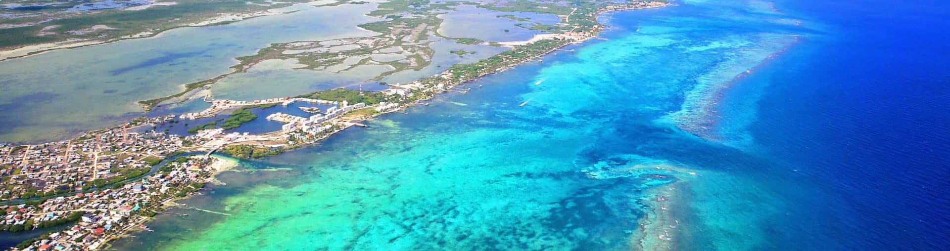Breathtaking aerial view of vibrant coastal landscapes and clear blue waters.