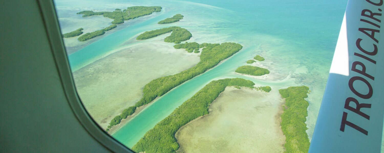 Breathtaking aerial view of serene tropical islands and clear turquoise waters.