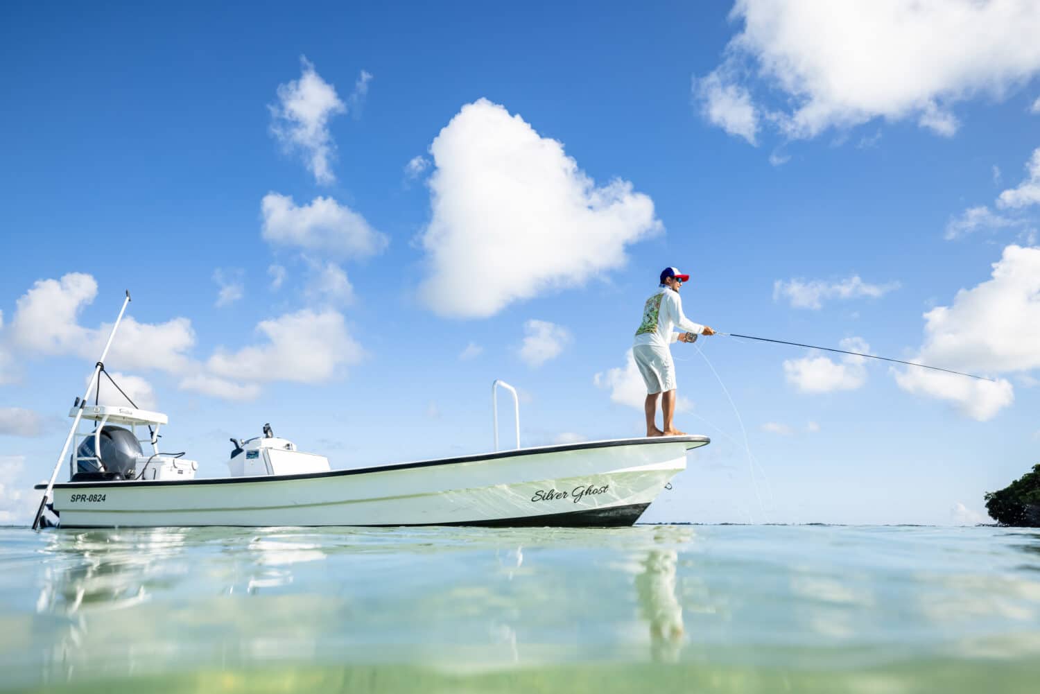 Enjoying a peaceful fishing trip under a clear blue sky.