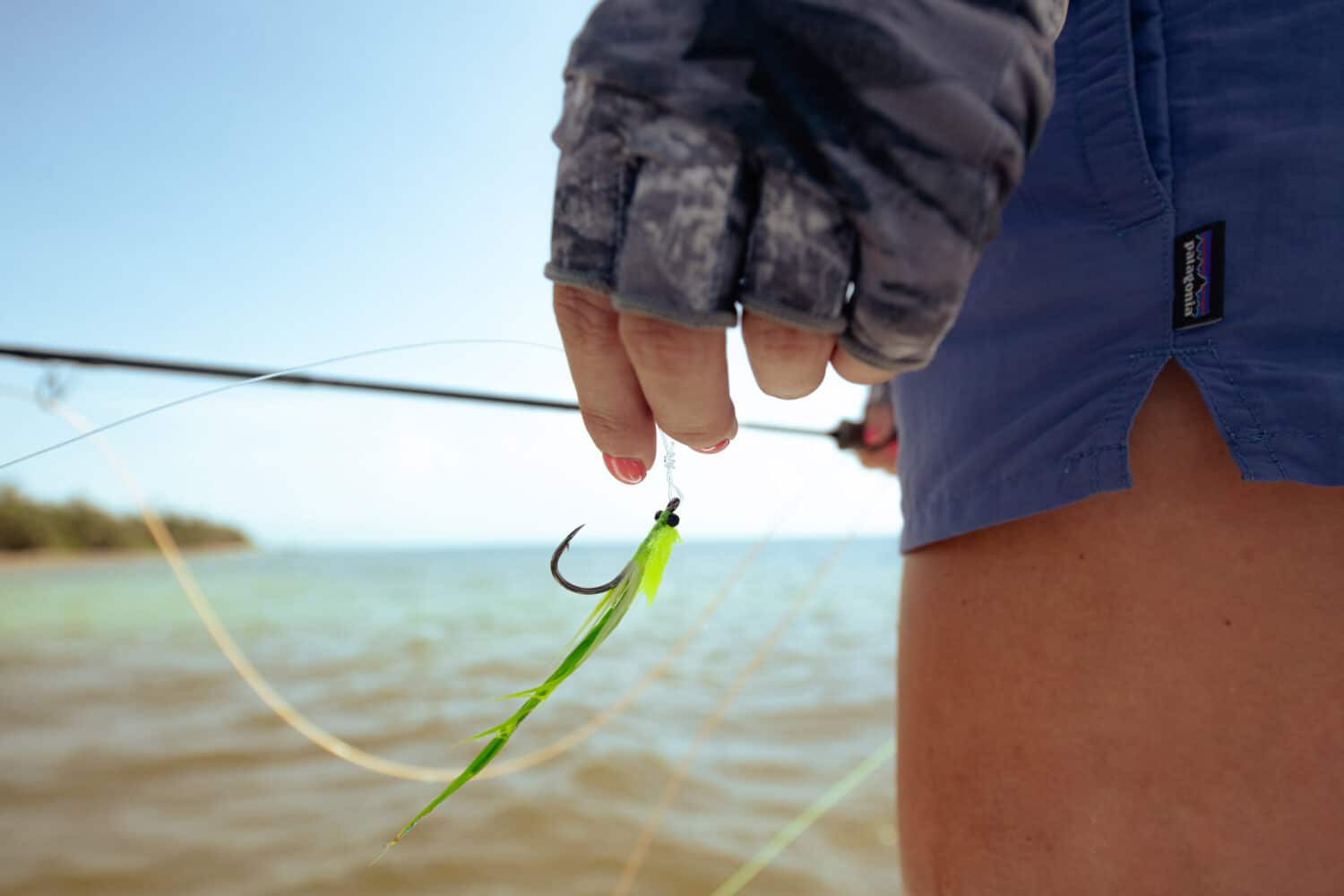 Preparing fishing gear by the shore for an exciting day on the water.