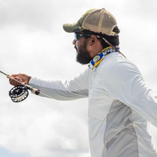 http://Fly%20fishing%20expert%20casting%20line%20during%20an%20adventurous%20fishing%20trip.