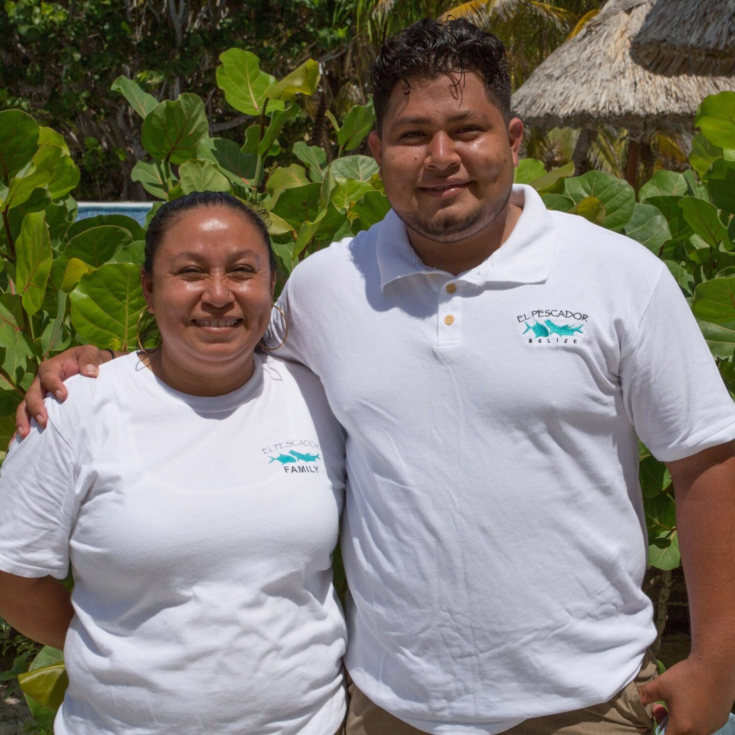 El Pescador Family members smiling in their beautiful beachside setting.