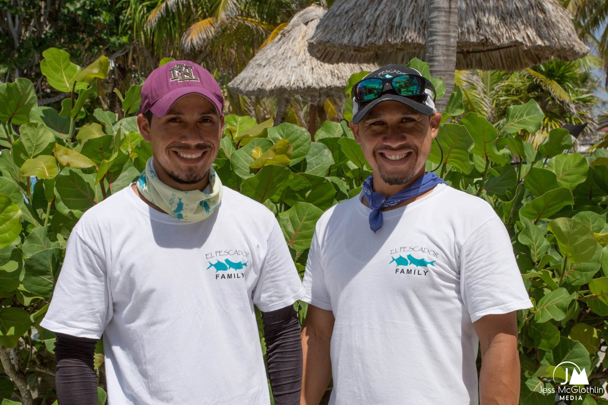 El Pescador Family members smiling in a tropical setting.