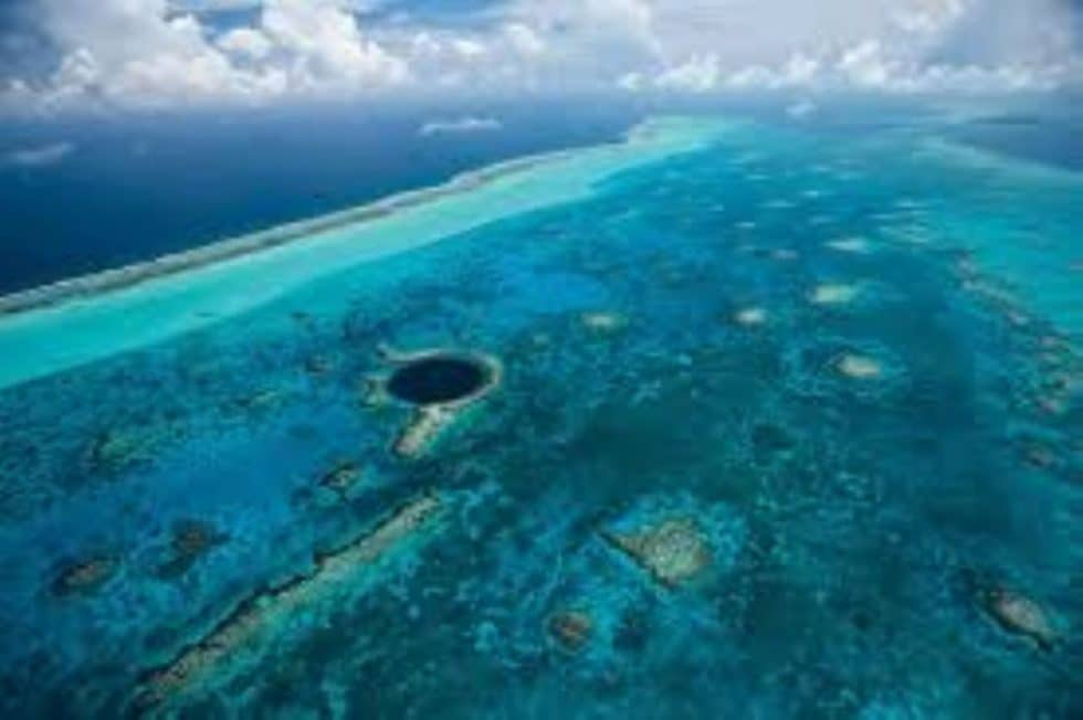 Stunning aerial view showcasing vibrant tropical waters and coral formations.