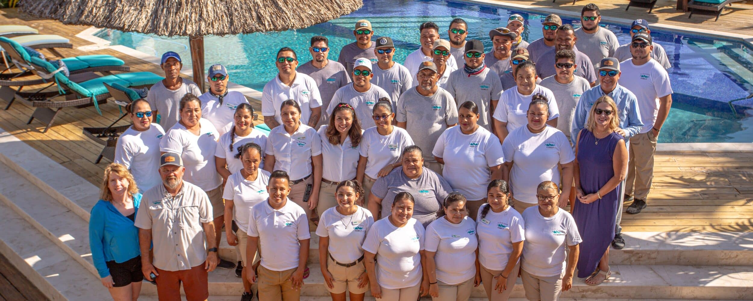Vibrant team gathering by the pool, showcasing collaboration and camaraderie.