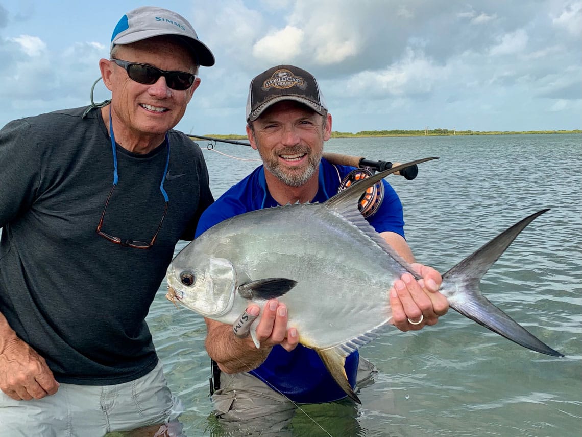 Anglers celebrate a successful catch while enjoying their fishing adventure.