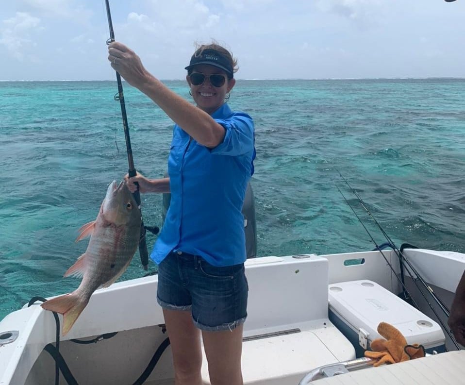 Catch of the Day: Angler with a Snapper on a Reef Fishing Trip.