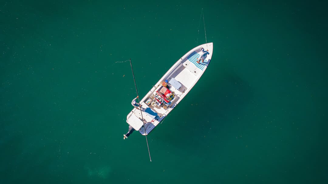 Fishing Boat On Calm Water